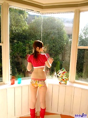 Japanese cutie starts taking off her clothes to show off