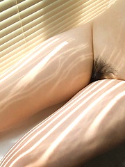 Hot Japanese babe enjoys playing with her big tits